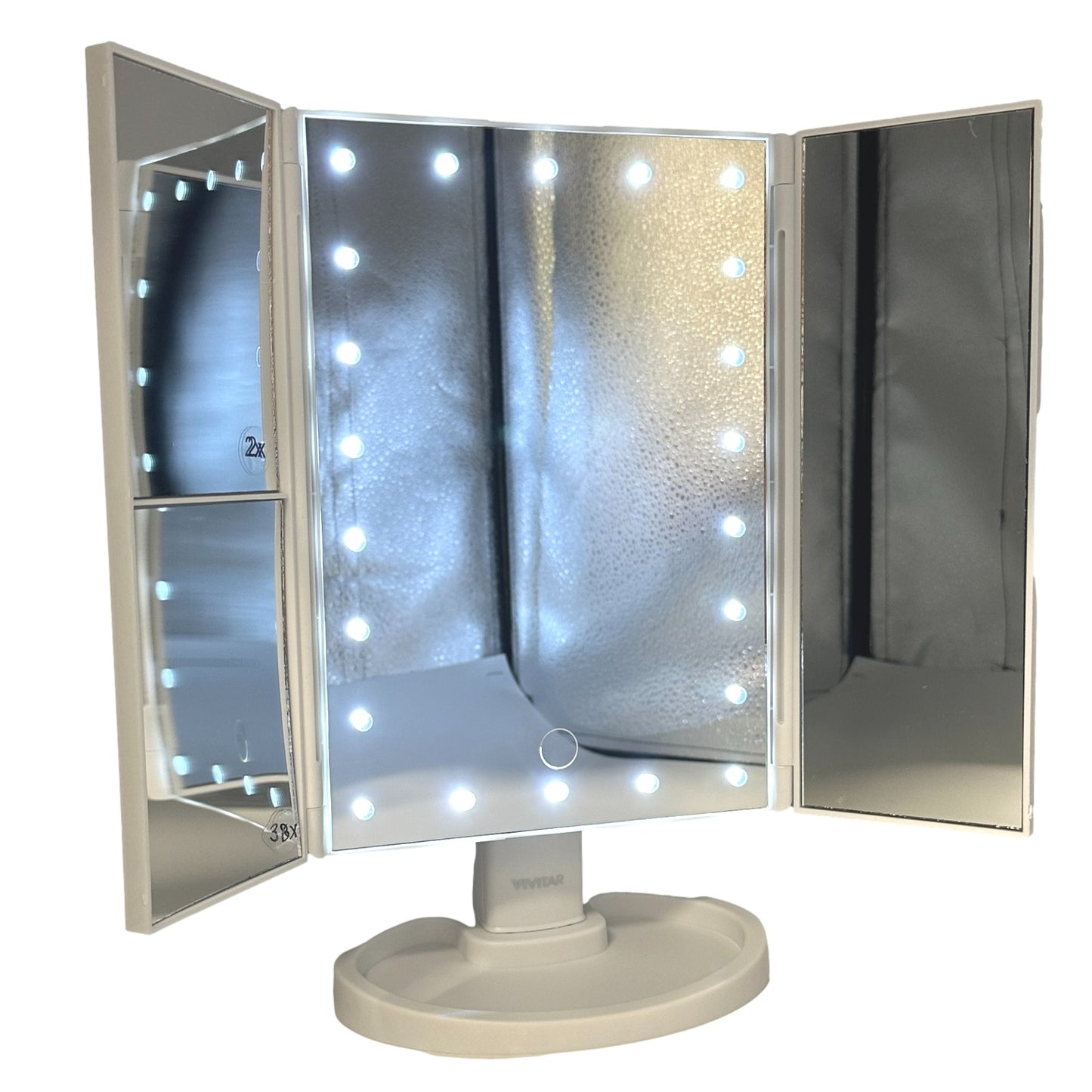 White tri-fold lighted makeup mirror with storage base.