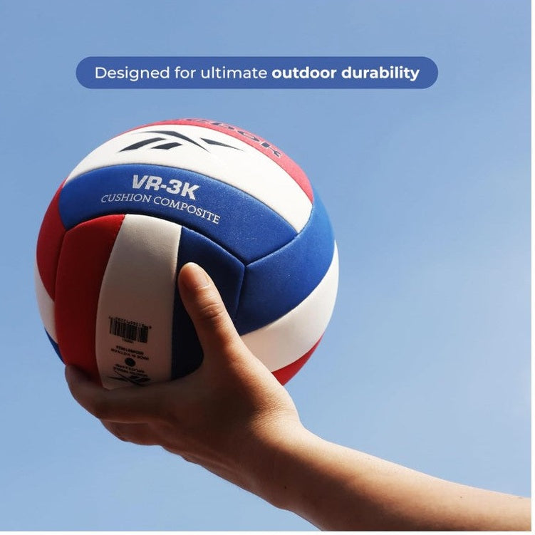Person holding a red, white, and blue VR-3K volleyball.
