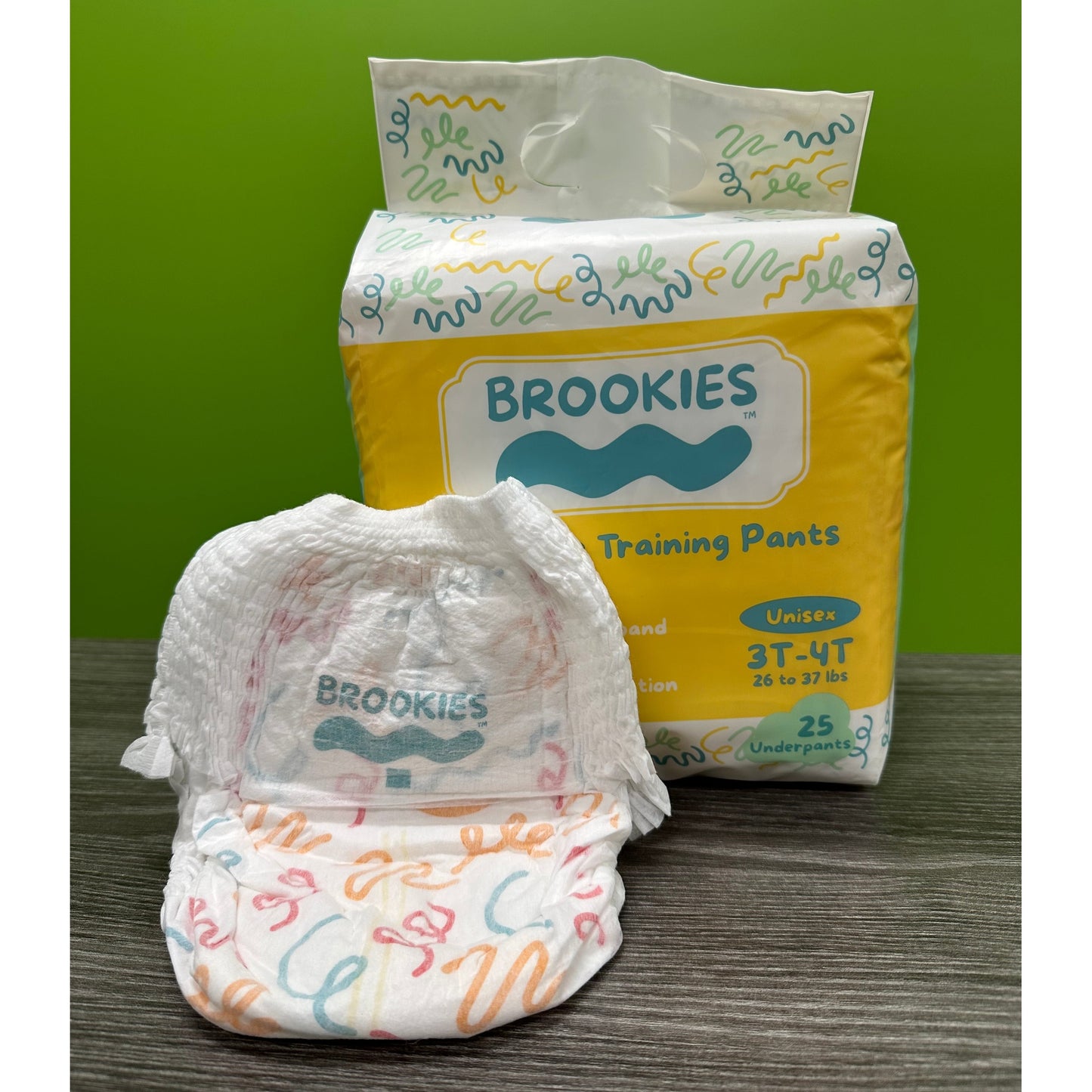 A package of "Brookies" brand training pants with a sample pull-up in front.