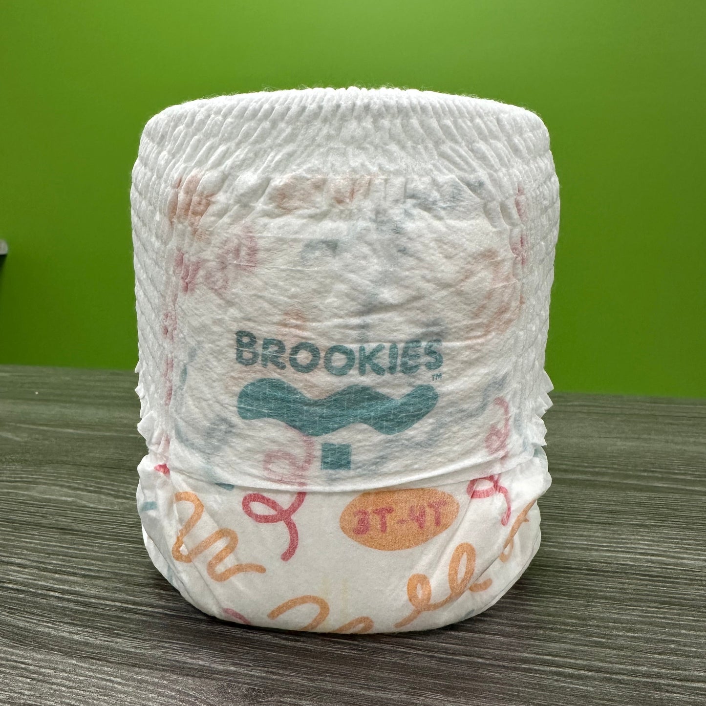White diaper with colorful designs.
