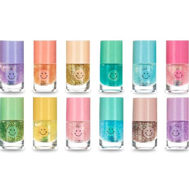 An assortment of glitter nail polish bottles with smiling face decals.