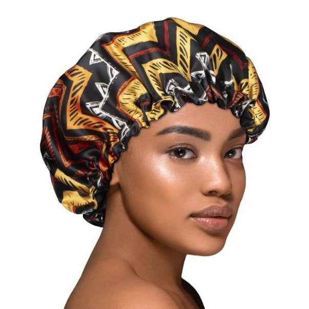 REVERSIBLE TRIBAL PRINT SATIN CAPP
