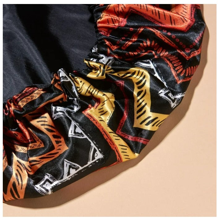 REVERSIBLE TRIBAL PRINT SATIN CAPP