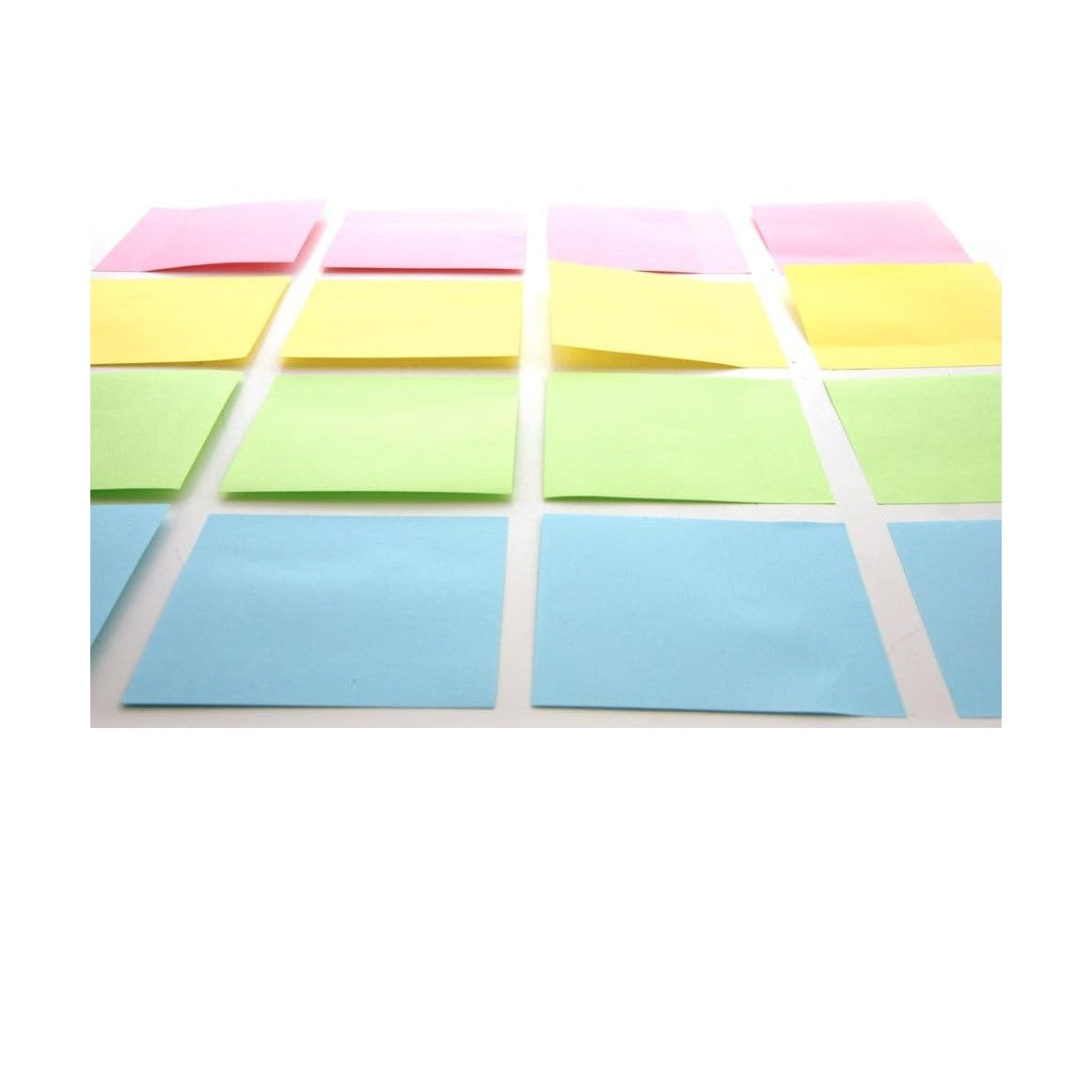 A grid of pink, yellow, green, and blue sticky notes on a white surface.
