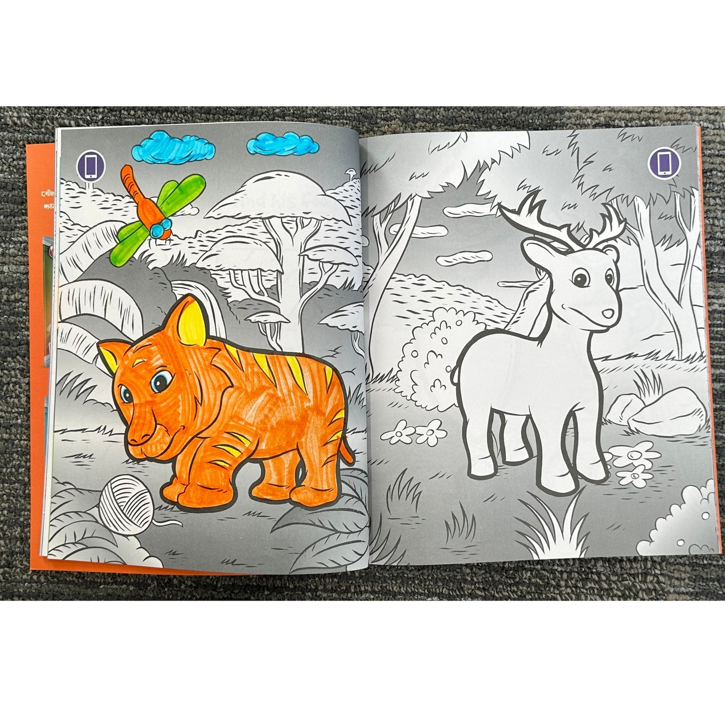 Opened coloring book with a partially colored tiger and a non-colored deer.