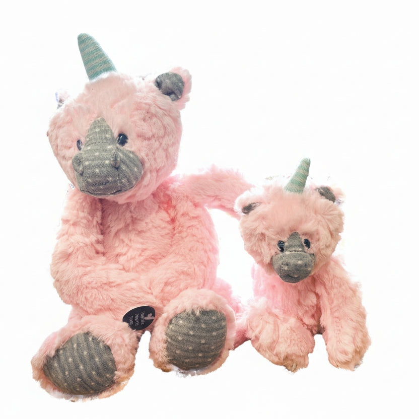 Two pink plush toys resembling unicorns on a white background