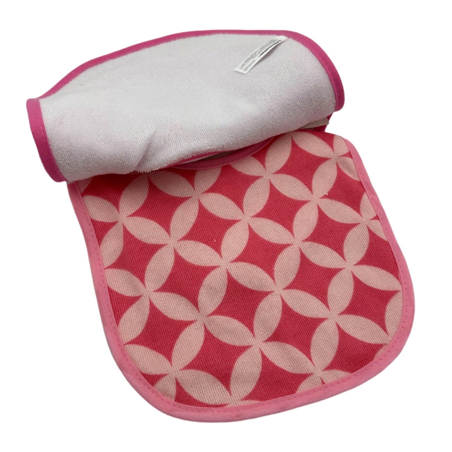 Pink and white floral patterned fabric diaper changing pad with pink trim, folded over a white terry cloth pad with pink trim.