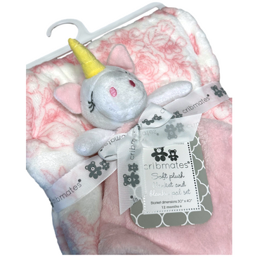 A baby blanket set with a white unicorn plushie, featuring a white and pink floral blanket, a pink blanket, and a white ribbon with bear illustrations, attached to a tag that describes it as a "Soft plush blanket and blankie pal set."