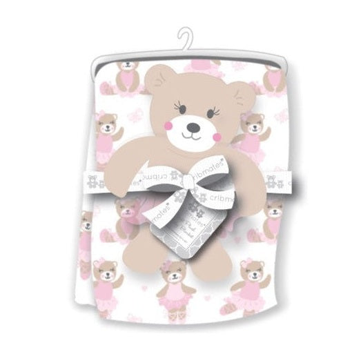 A baby blanket with a ballerina bear pattern packaged with a cardboard bear and ribbon.