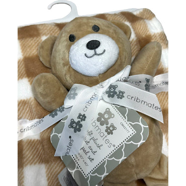 A plush teddy bear and a brown and white checkered blanket on a white hanger, tied with a white ribbon.