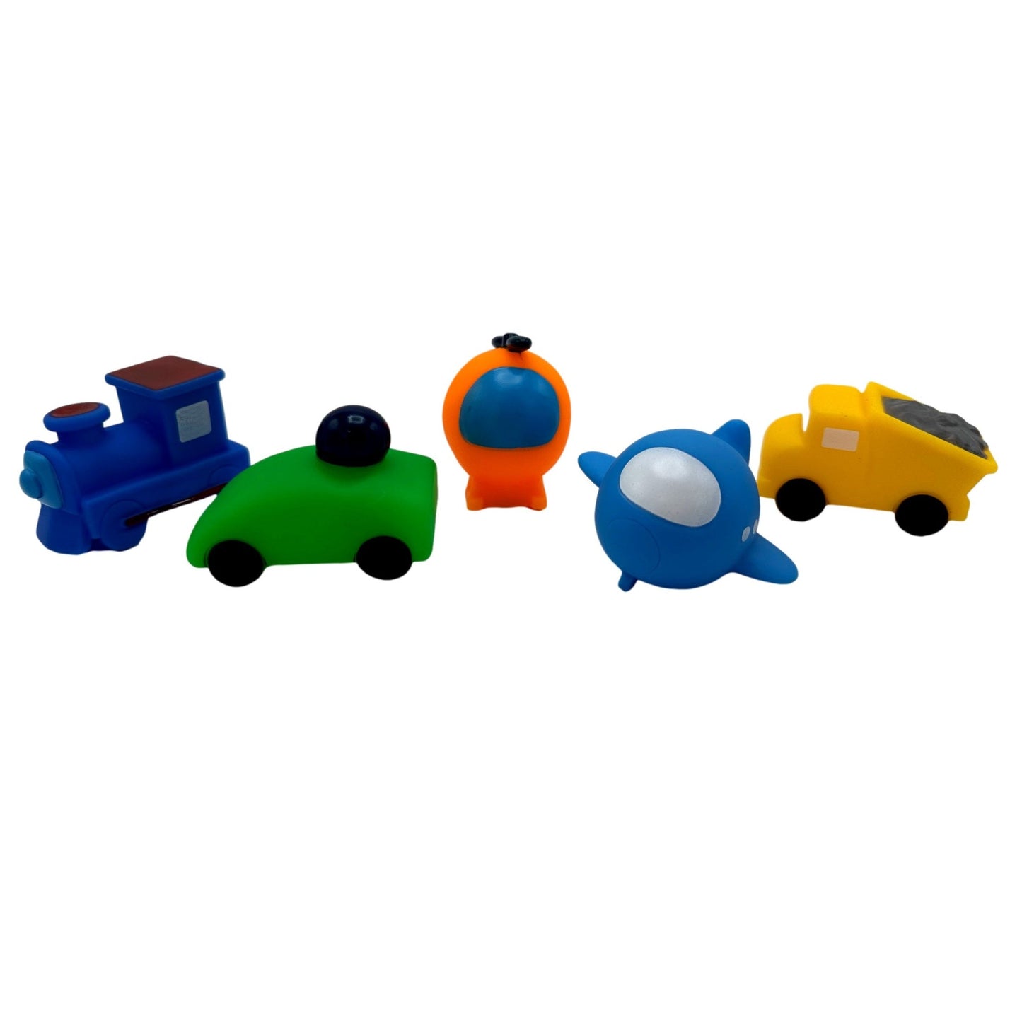 Colorful rubber toys: blue train, green car, orange rocket, blue airplane, yellow dump truck.