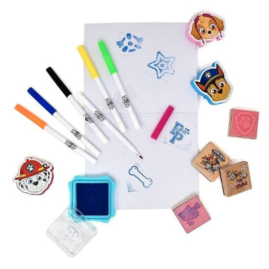 A Paw Patrol-themed art set featuring markers, stamps, and ink pads on a white background.