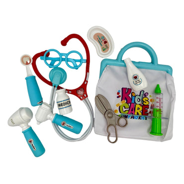 A plastic doctor's kit with a white bag and blue handle, surrounded by plastic medical tools in blue, red, green, white, and silver.