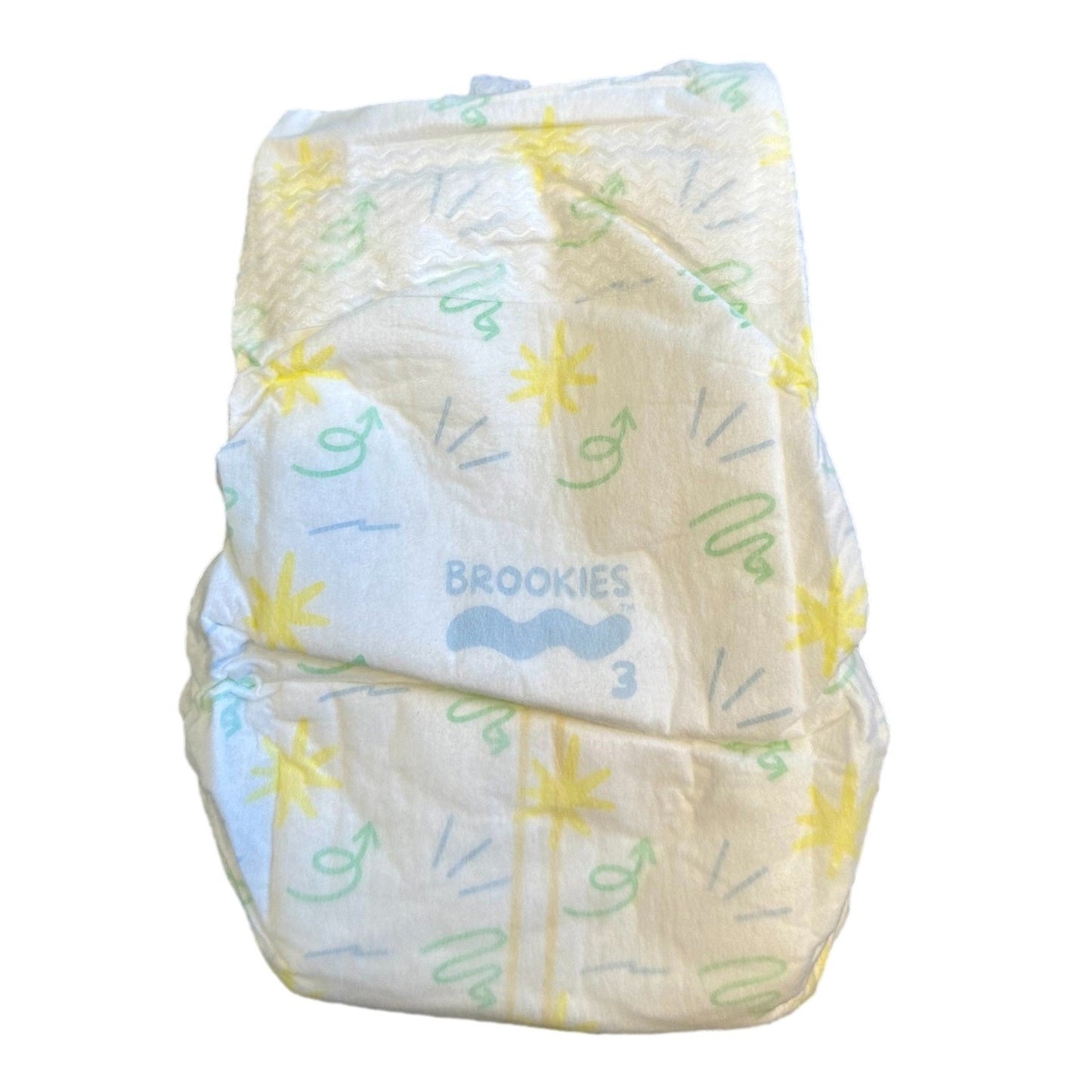 Folded white baby diaper with yellow stars and green arrow designs.