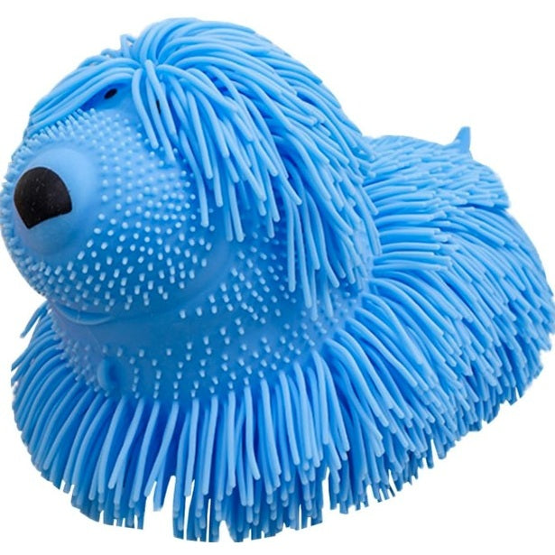 Blue rubber toy dog with stringy fur.