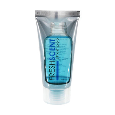 Close-up of a travel-sized transparent tube of blue Fresh Scent shampoo with silver trim.