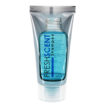 Close-up of a travel-sized transparent tube of blue Fresh Scent shampoo with silver trim.