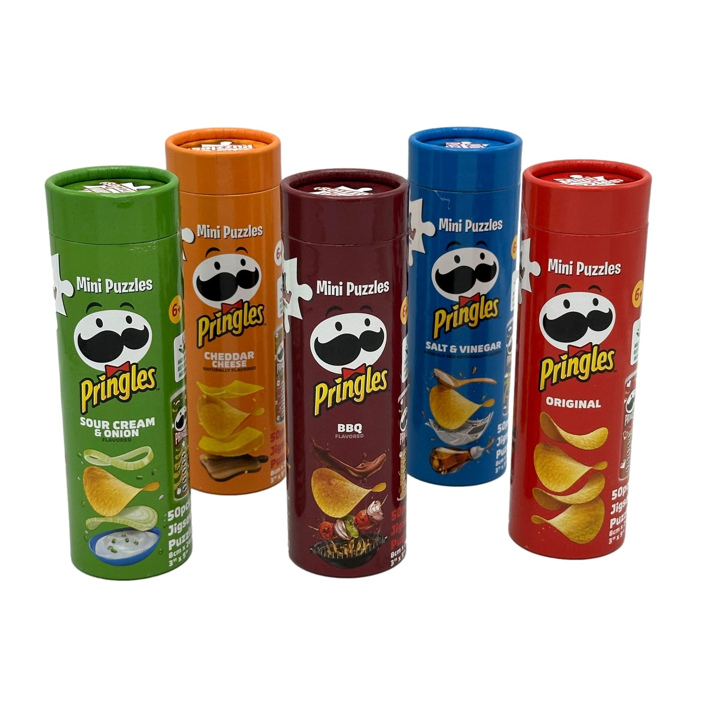 Five cylindrical boxes of Pringles-themed mini puzzles, each a different flavor and color, standing in a row.