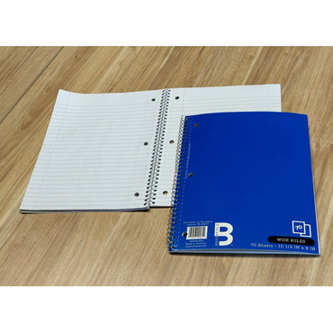 Two wide-ruled spiral notebooks on a wooden surface. One notebook is open, revealing lined paper. The other notebook is closed with a blue cover.