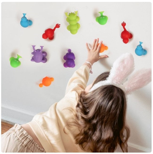40 PC DINOSAUR SUCTION SENSORY TOYS IN PINK DINO EGG