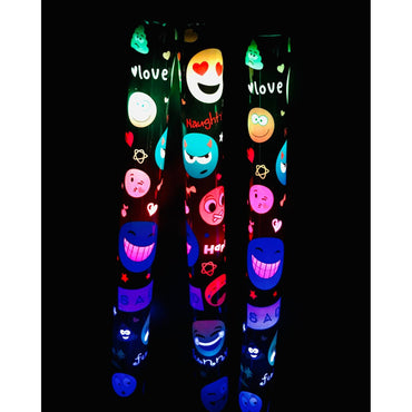 Three glowing black tubes with colorful emoji designs against a black background.