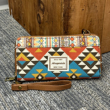 Aeropostale wristlet purse with colorful geometric pattern, brown leather strap.