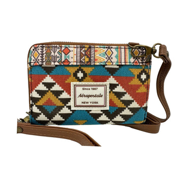 A patterned Aeropostale purse with a brown strap.