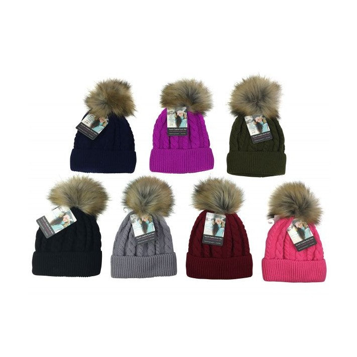 Eight cable-knit beanies with faux-fur pom-poms in various colors.