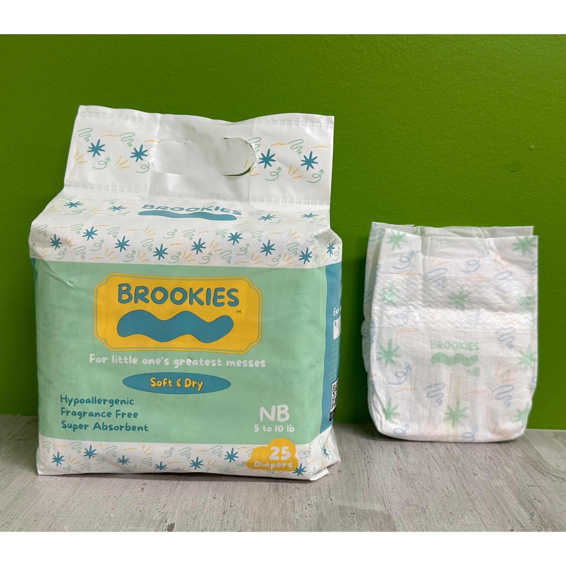 Package of Brookies brand newborn diapers next to a single diaper.