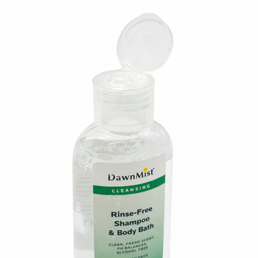 Clear bottle of DawnMist Rinse-Free Shampoo & Body Bath with a white cap on a white background