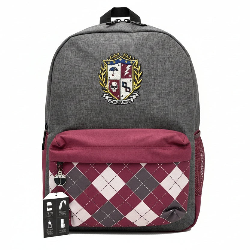 Gray backpack with a burgundy pocket featuring an argyle pattern and a crest on the front.