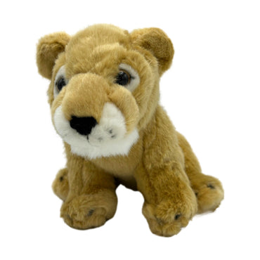 Stuffed lion cub toy sitting.