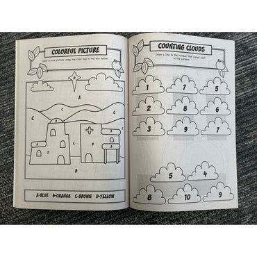 Open coloring/activity book on carpet.