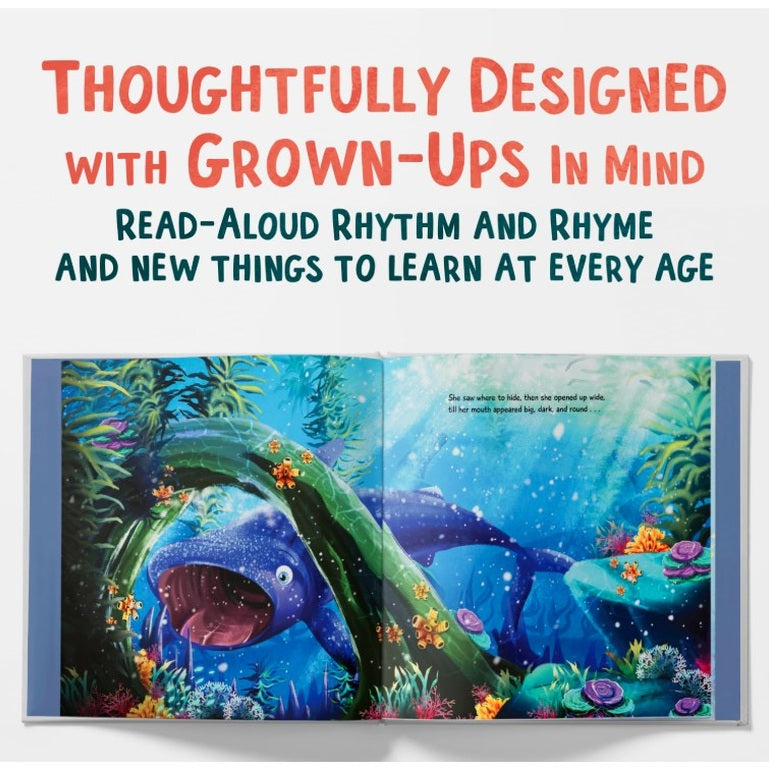 Open children's book showing an illustration of a whale underwater.