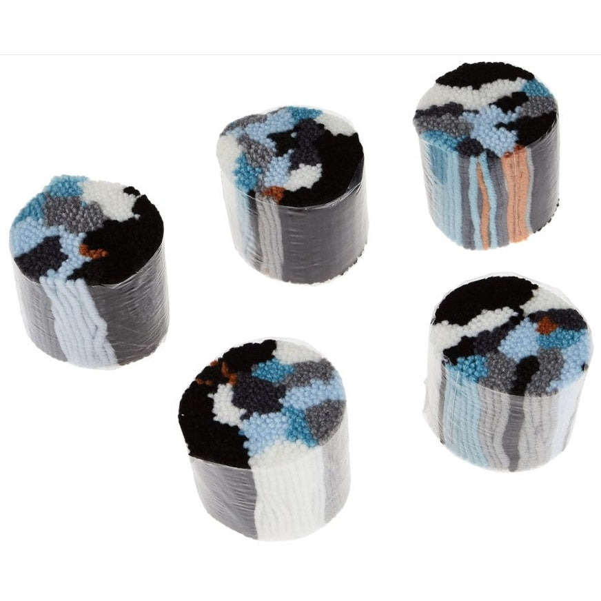 Five rolls of colorfully patterned wool yarn wrapped in plastic.