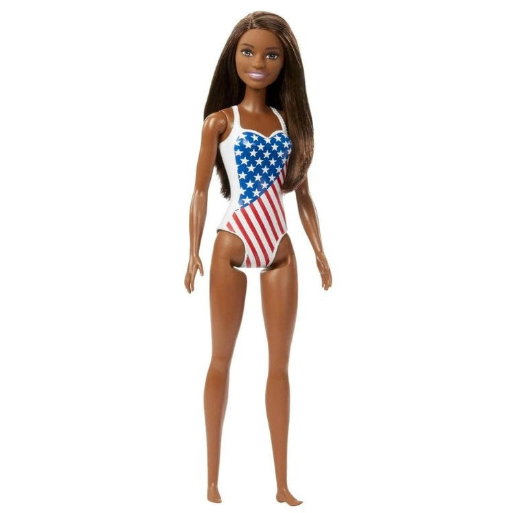 African-American Barbie doll wearing an American flag swimsuit, standing.