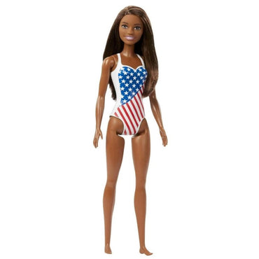 African-American Barbie doll wearing an American flag swimsuit, standing.