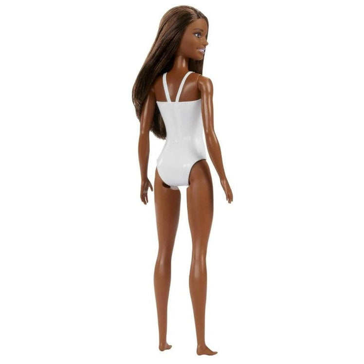 A dark-skinned Barbie doll in a white swimsuit.