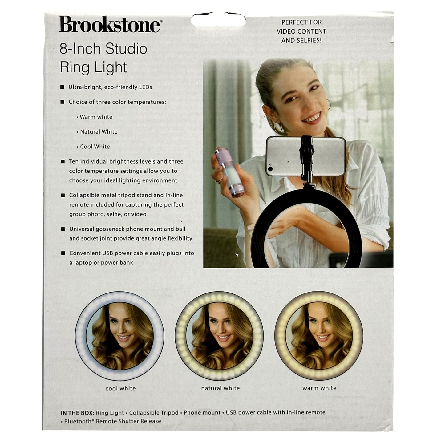 Product packaging for a Brookstone 8-inch studio ring light with a woman holding a phone in the ring light above sample images.