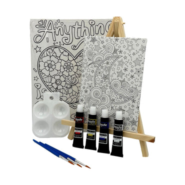 A DIY painting kit with two canvases on a wooden easel, four tubes of acrylic paint, paint brushes, and a paint palette.