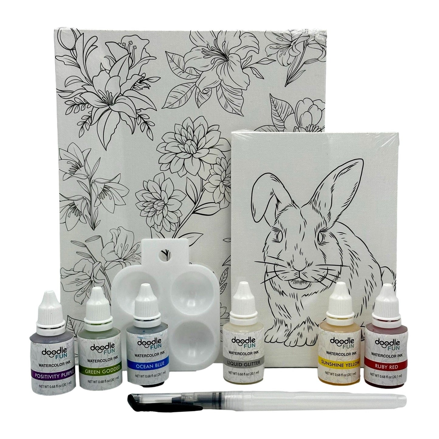 Watercolor paint kit with two canvas panels featuring flower and bunny designs, assorted colored inks, a palette, and a paintbrush.