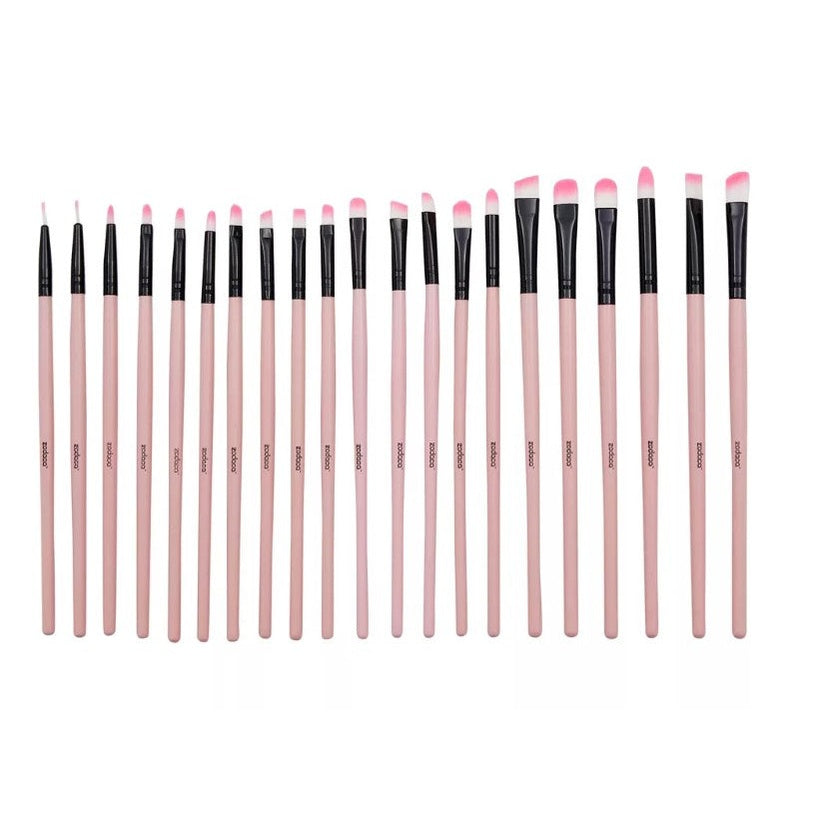 A variety of pink makeup brushes.