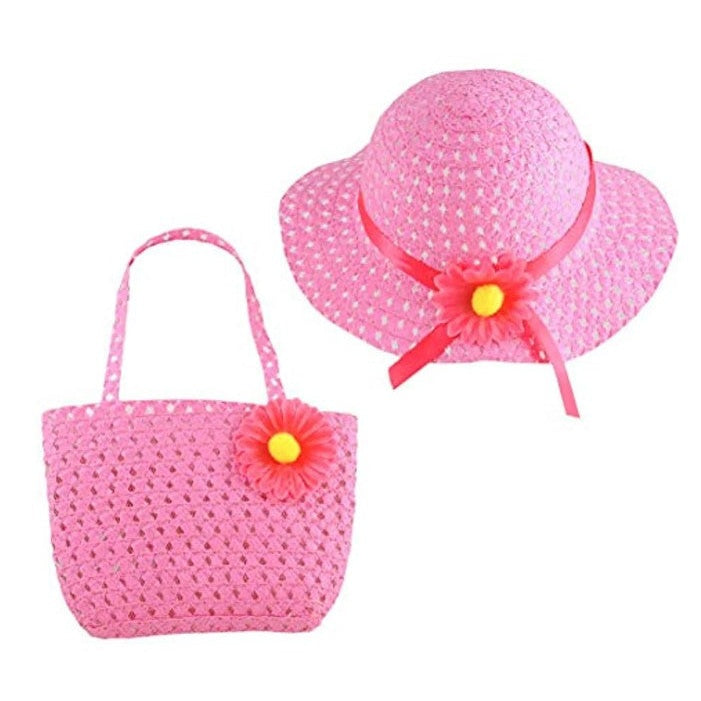 Pink woven hat with pink ribbon and flower, and a matching tote bag with a flower detail.