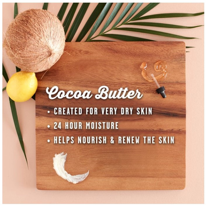 Product shot featuring a coconut, lemon, and palm frond, arranged on a wooden board that displays "Cocoa Butter" text and related benefits.