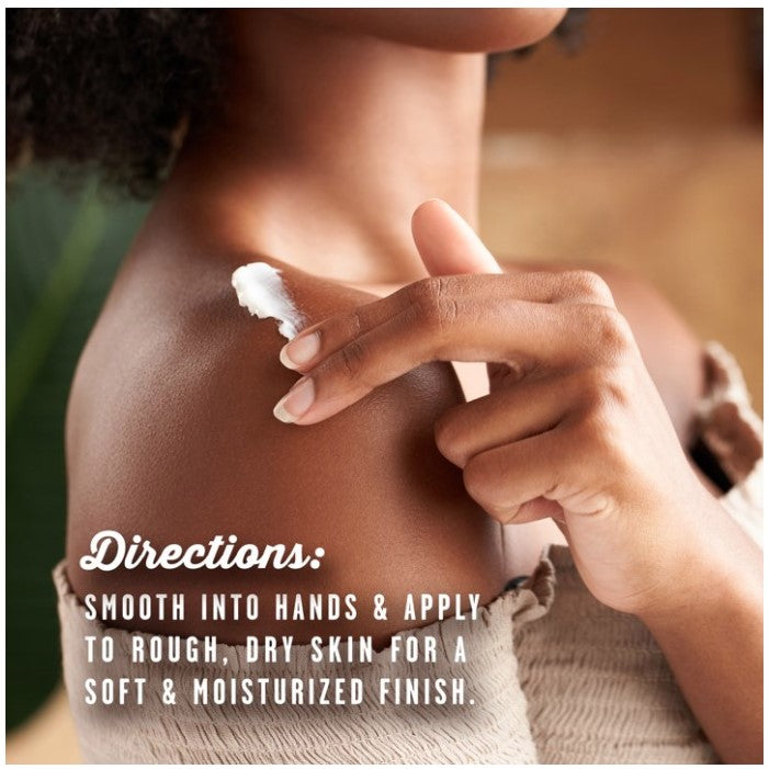A person applying white lotion to their shoulder.