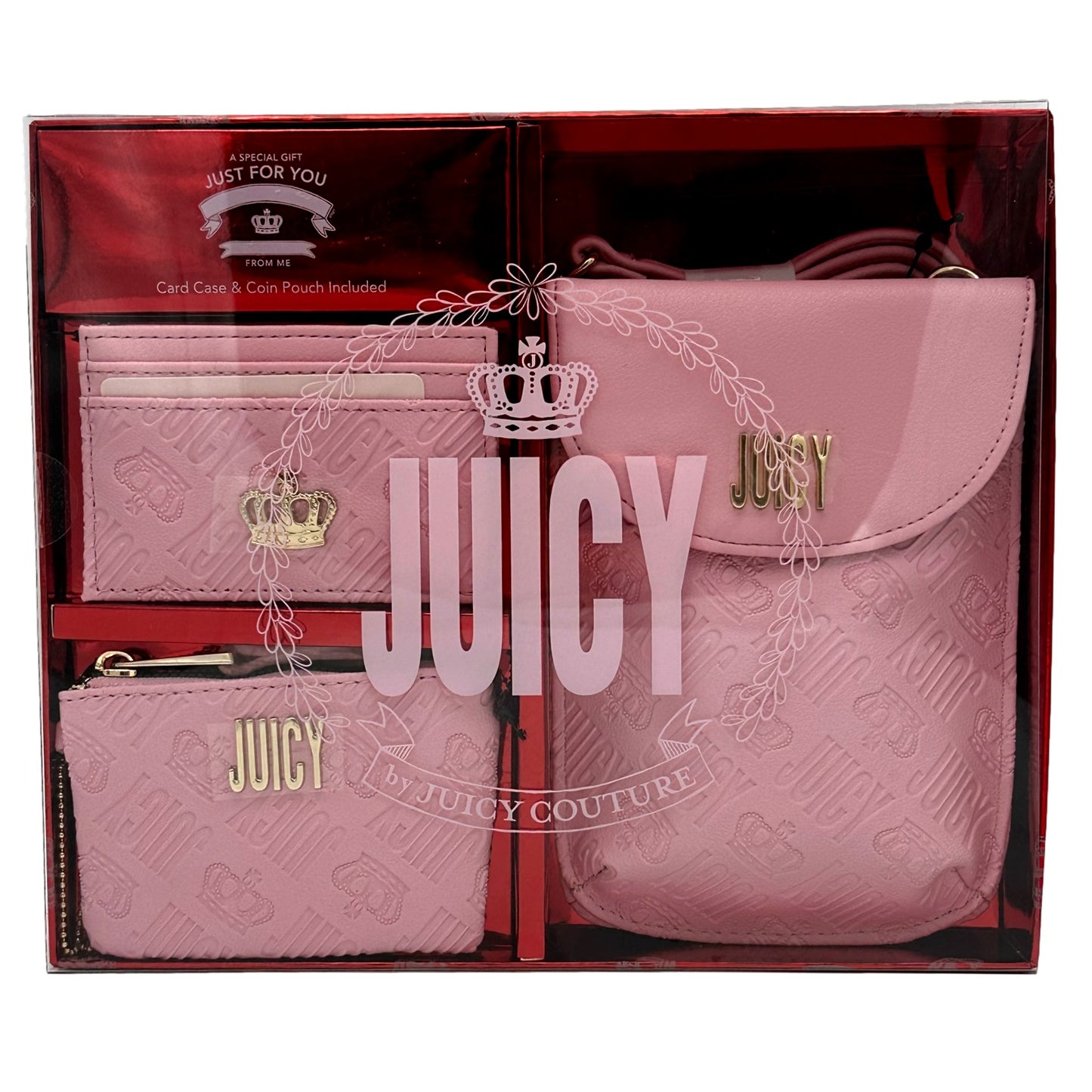 A pink Juicy Couture gift set with a card case, coin pouch, and crossbody bag inside a glossy box.