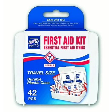 A white travel-sized first aid kit box with "Lucky Super Soft" branding and "First Aid Kit" in red and blue text, filled with bandages and medical supplies.
