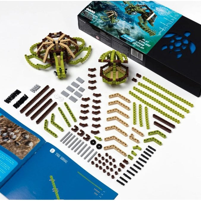 A kit for building a turtle, with a finished turtle toy, spare parts, a box, and a manual.