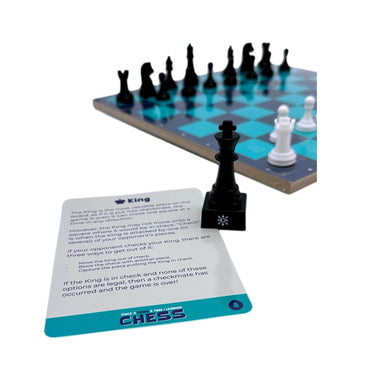 A product shot of a chess set with a black king chess piece and a card explaining the rules for the king.
