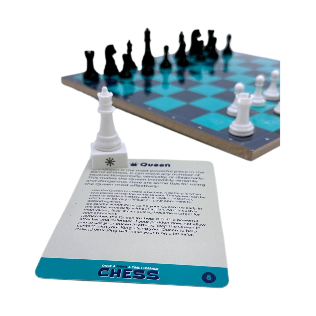 A product shot depicts a chess set with a white queen chess piece placed on top of a chess card that reads, "Queen," along with information on how to use the queen most effectively. In the background, out-of-focus, is a chess board with black and white pieces.